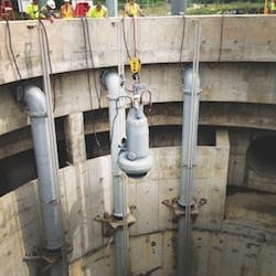 One_of_nine_Flygt_pumps_being_lowered_into_position_in_deep_well_copy One_of_nine_Flygt_pumps_being_lowered_into_position_in_deep_well_copy