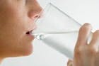 drinking a glass of water