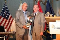Roland Lindsay (L) receives Yoakum Award from 2011 recipient Darryl Cloud