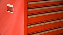 A Standing Red Toolbox With Closed Drawers