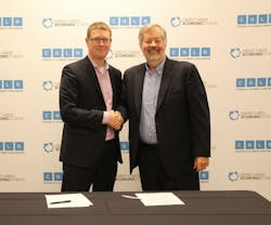Mark Fisher, president and CEO of the Council of the Great Lakes Region, and Dean Amhaus, president and CEO of The Water Council shake hands after signing partnership agreement. Mark Fisher, president and CEO of the Council of the Great Lakes Region, and Dean Amhaus, president and CEO of The Water Council shake hands after signing partnership agreement.