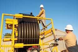 Coming on reels that hold 800 feet of HDPE pipe speeds work for the Red River Authority crew and keeps joints to a minimum. Coming on reels that hold 800 feet of HDPE pipe speeds work for the Red River Authority crew and keeps joints to a minimum.
