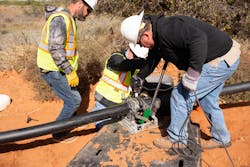 The Red River Authority crew uses heat fusion to join the HDPE pipe, creating a leak-free water line. The Red River Authority crew uses heat fusion to join the HDPE pipe, creating a leak-free water line.