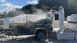 Large Diameter Sewer Rehab workers prepare pipe lining. Large Diameter Sewer Rehab workers prepare pipe lining.