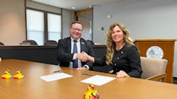 Egg Harbor City Mayor Lisa Jiampetti (right) signs agreement to sell its water and wastewater system to New Jersey American Water. Egg Harbor City Mayor Lisa Jiampetti (right) signs agreement to sell its water and wastewater system to New Jersey American Water.
