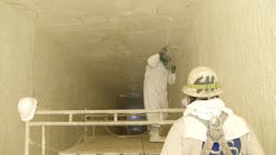 Workers rehabilitate a concrete channel for a wastewater treatment plant by applying a coating. Workers rehabilitate a concrete channel for a wastewater treatment plant by applying a coating.