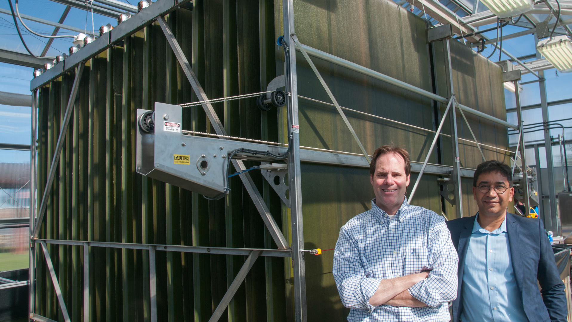 The algae reactor was developed by retired MWRD Assistant Director of Monitoring and Research Tom Kunetz (on the left) and MWRD Principal Environmental Scientist Kuldip Kumar with partners.