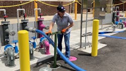 A worker turns a valve for water flow at the South Platte Renew Pilot and Research Center in Englewood, Colorado. A worker turns a valve for water flow at the South Platte Renew Pilot and Research Center in Englewood, Colorado.