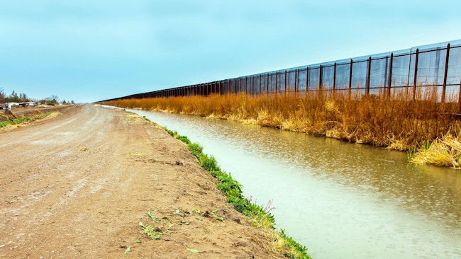 On the US border fence to Mexico at El Paso