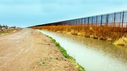 On the US border fence to Mexico at El Paso On the US border fence to Mexico at El Paso