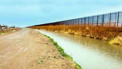 On the US border fence to Mexico at El Paso On the US border fence to Mexico at El Paso