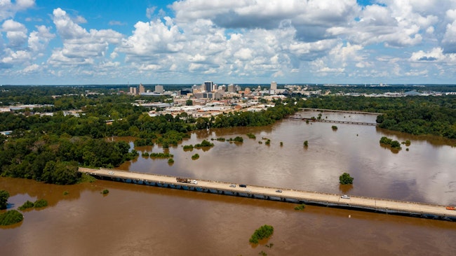 Jackson, MS Skyline with flooding Pearl River in the foreground in August 2022