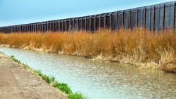 The US border fence to Mexico at El Paso The US border fence to Mexico at El Paso