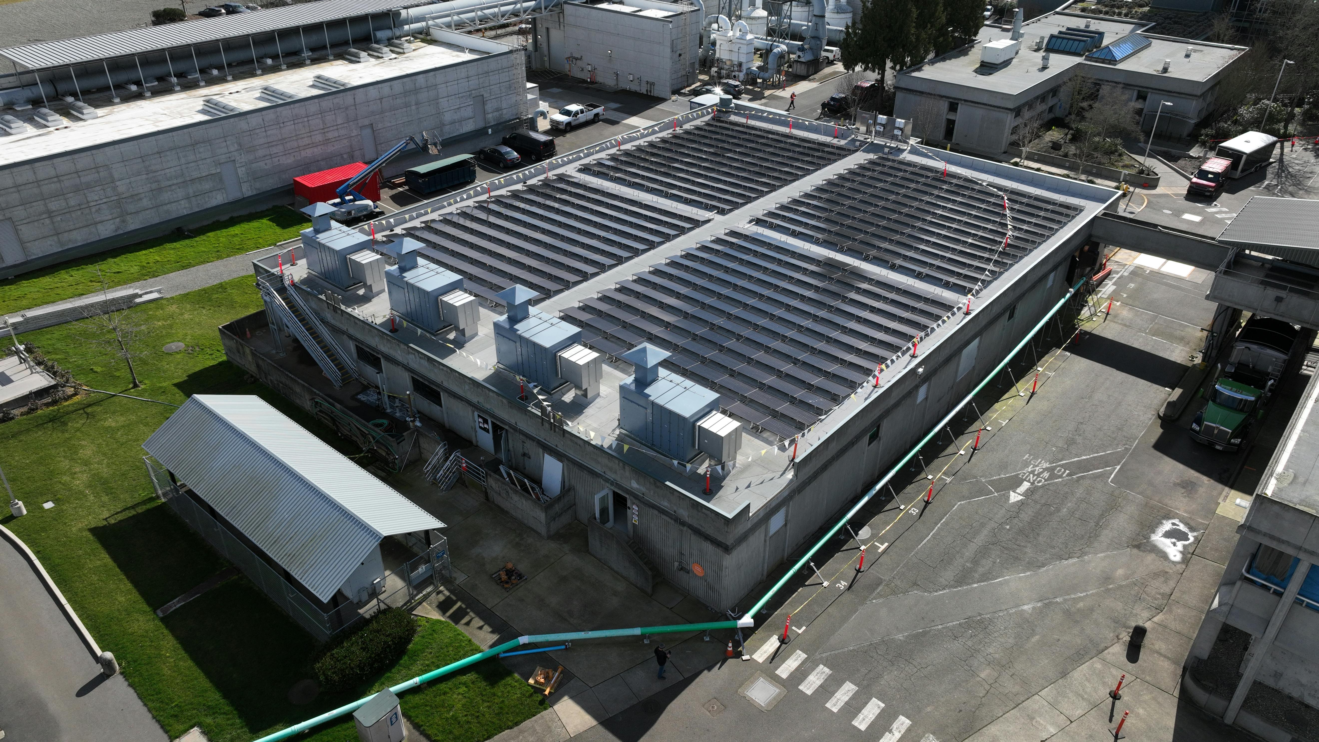 A view of the solar panels and HVAC system upon completion of the Budd Inlet Treatment Plant project that upgraded an aging plant by integrating renewable energy strategies with energy efficient technology that would also achieve compliance targets.