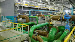 Pipes, filters and sewage pumps inside modern industrial wastewater treatment plant.