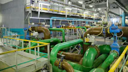 Pipes, filters and sewage pumps inside modern industrial wastewater treatment plant. Pipes, filters and sewage pumps inside modern industrial wastewater treatment plant.