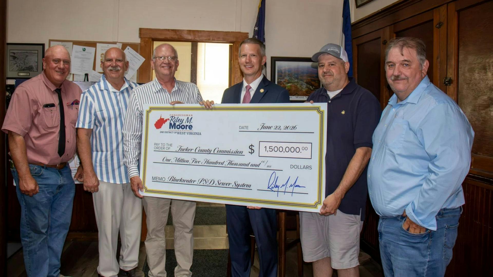 Congressman Riley M. Moore presents a $1.5M check for wastewater infrastructure in West Virginia.