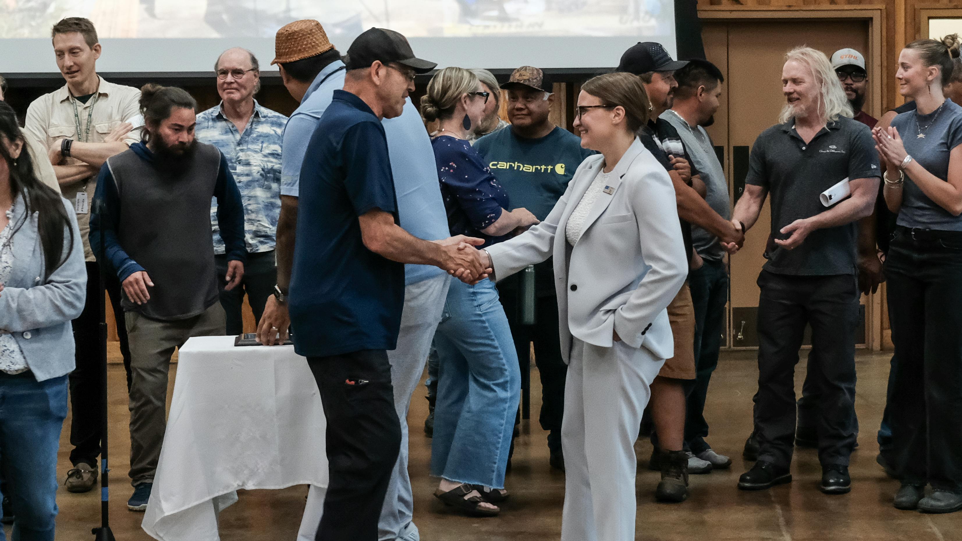 EPA Regional Administrator shakes hands with Lummi Tribal Council (Photo credit: Washington Department of Ecology).