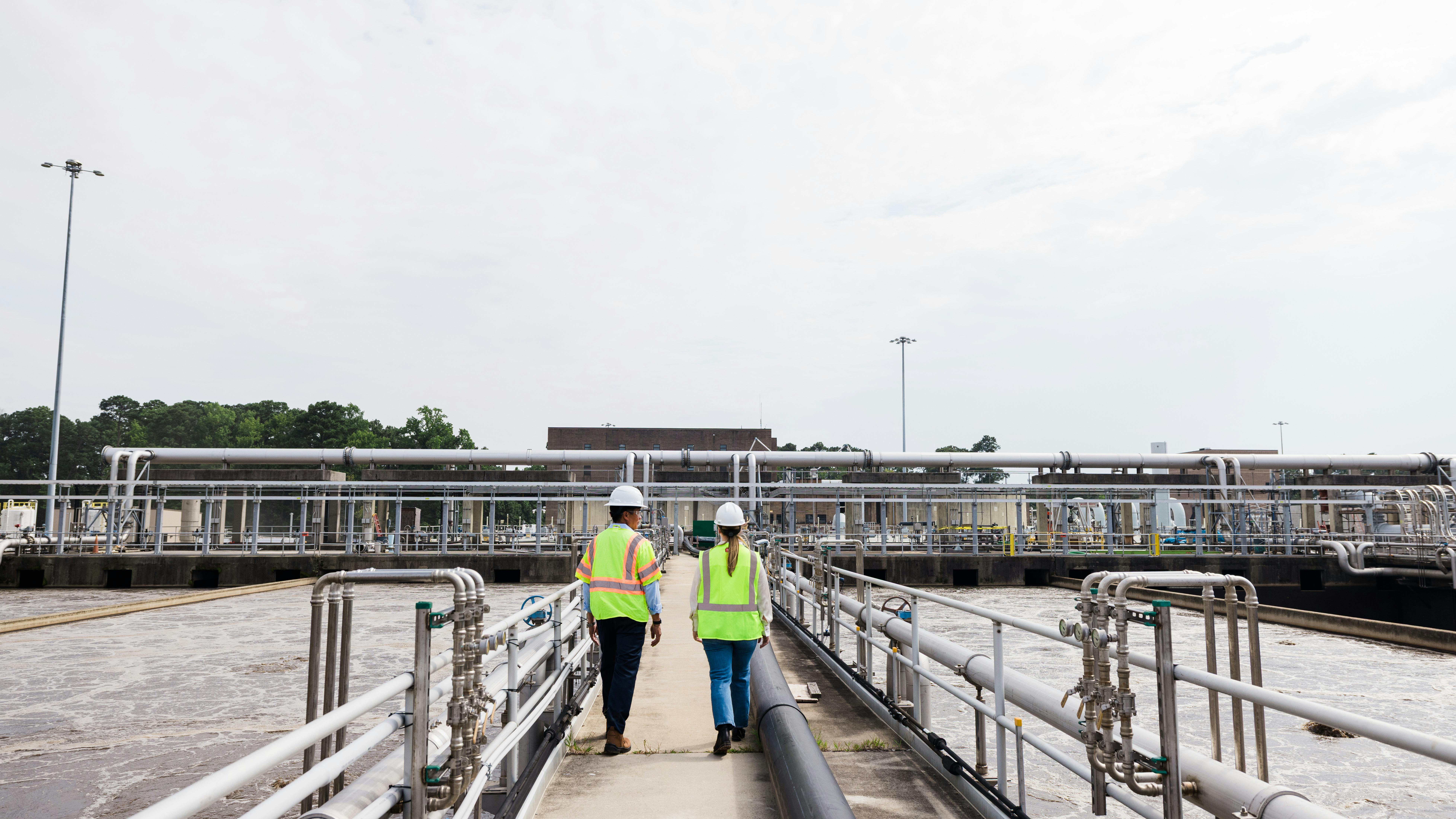 Jay Bernas, HRSD CEO and general manager, walks through one of the HRSD facilities with Georgina Schaefer, Pentair Municipal and Infrastructure General Manager. HRSD is working closely with Pentair to install the Xcentric impeller-based pumps to improve operations and maintenance.