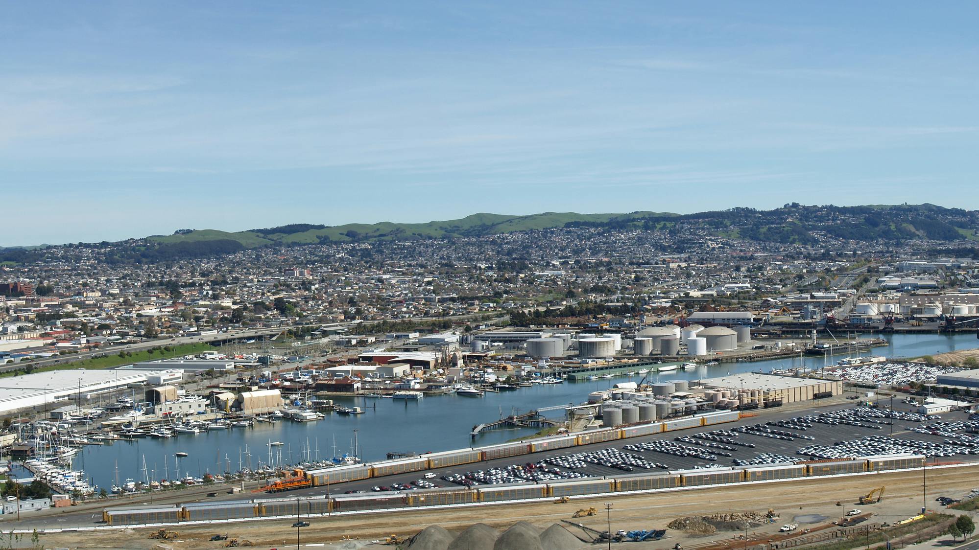An aerial panoramic view of ship building factories, car manufacturing plants and oil refineries, in Richmond, California