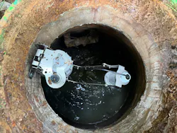 This device installed on a sewer riser beneath a manhole monitors sewer levels for utility and collection system managers to better understand the flow of sewage through their system.